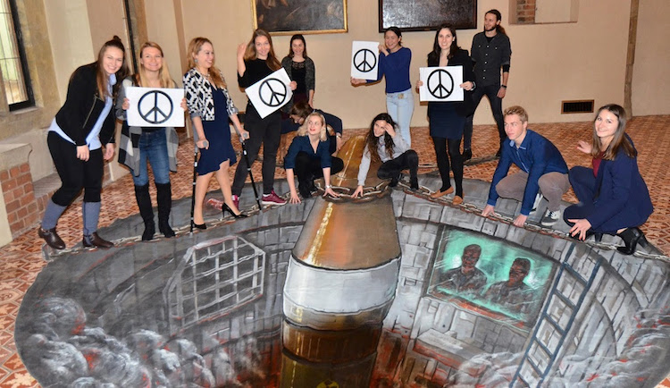 Photo: Participants in the conference 'prevent' a nuclear missile from being launched from Charles University in Prague. Credit: UNFOLD ZERO