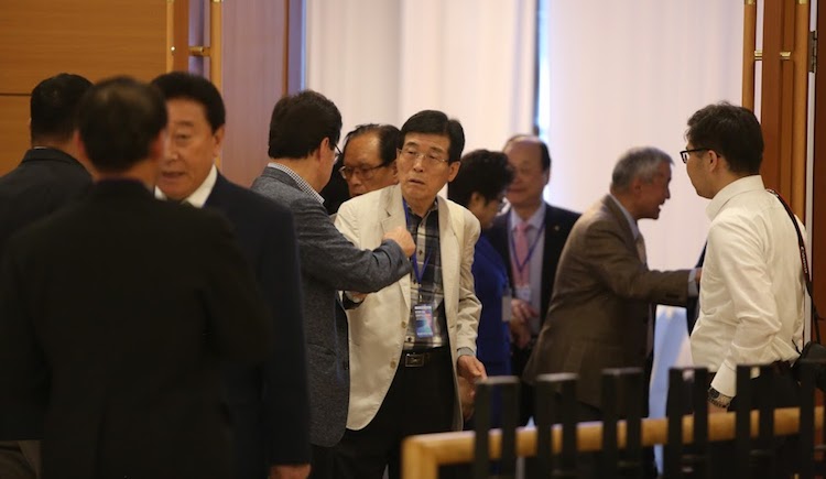Photo: Ulaanbaatar Forum participants engaged in discussion during a break. Credit: Blue Banner.