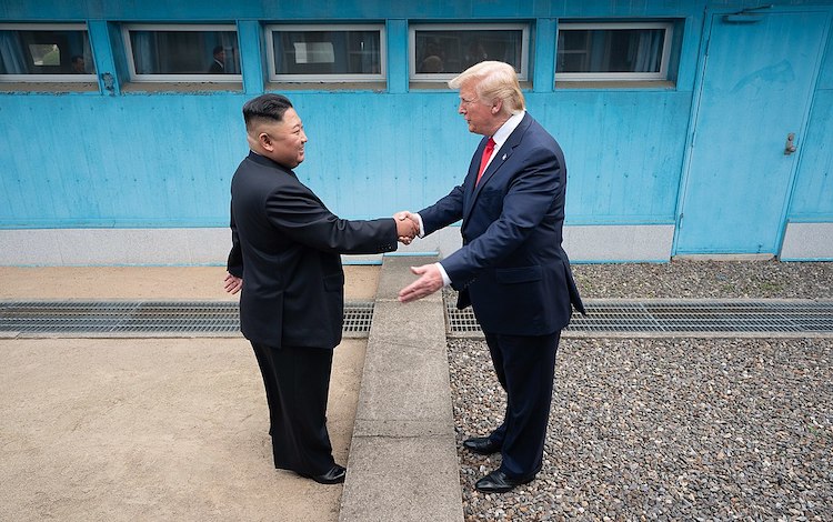 Photo: President Donald Trump shakes hands with North Korea’s Kim Jong Un on 30 June 2019, as the two leaders meet at the Korean Demilitarized Zone. (Official White House Photo by Shealah Craighead) 