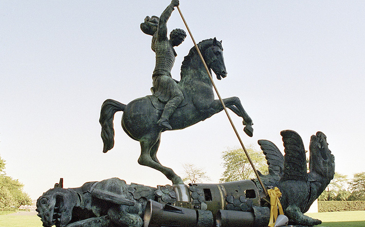 Photo: Sculpture depicting St. George slaying the dragon. The dragon is created from fragments of Soviet SS-20 and United States Pershing nuclear missiles. UN Photo/Milton Grant.