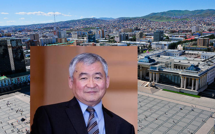 Photo: Dr Jargalsaikhan Enkhsaikhan (Credit: Global Peace Foundation) against the backdrop of Chinggis Khaan (Sükhbaatar) Square in Ulaanbaatar, the capital and largest city of Mongolia. CC BY-SA 4.0