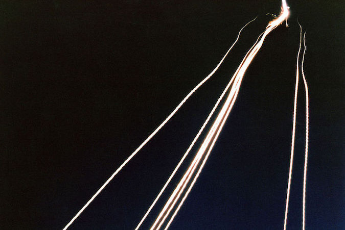 A time exposure of eight intercontinental ballistic missile reentry vehicles passing through clouds while approaching an open-ocean impact zone during a flight test. (U.S. Air Force photo)