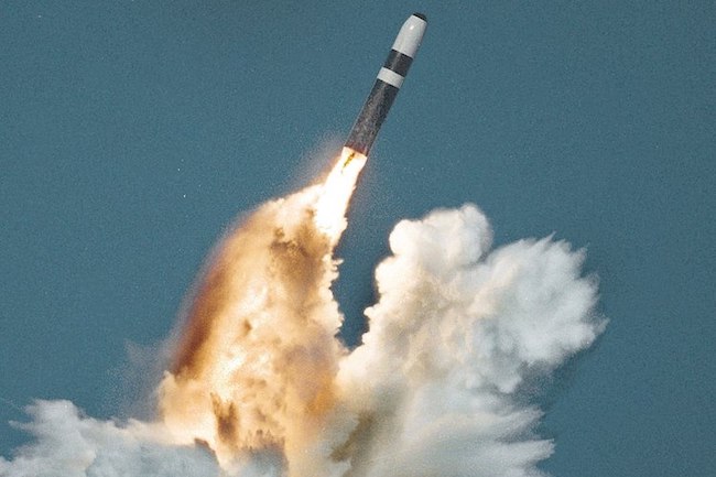 Image: A Trident II missile fires its first stage after an underwater launch from a Royal Navy Vanguard-class ballistic missile submarine. Source: Wikimedia Commons.